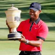 AKRON, OH - AUGUST 04:  Tiger Woods holds up the Gary Player Cup trophy after the Final Round of the World Golf Championships-Bridgestone Invitational at Firestone Country Club South Course on August 4, 2013 in Akron, Ohio. Woods won the tournament with a score of -15.  (Photo by Gregory Shamus/Getty Images)