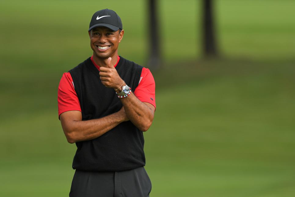 CHIBA, JAPAN - OCTOBER 28: Tiger Woods gives thumbs up to fans while standing on the 18th green during the trophy presentation after the final round of The ZOZO Championship at Accordia Golf Narashino Country Club on October 28, 2019 in Chiba, Japan. (Photo by Ben Jared/PGA TOUR via Getty Images)