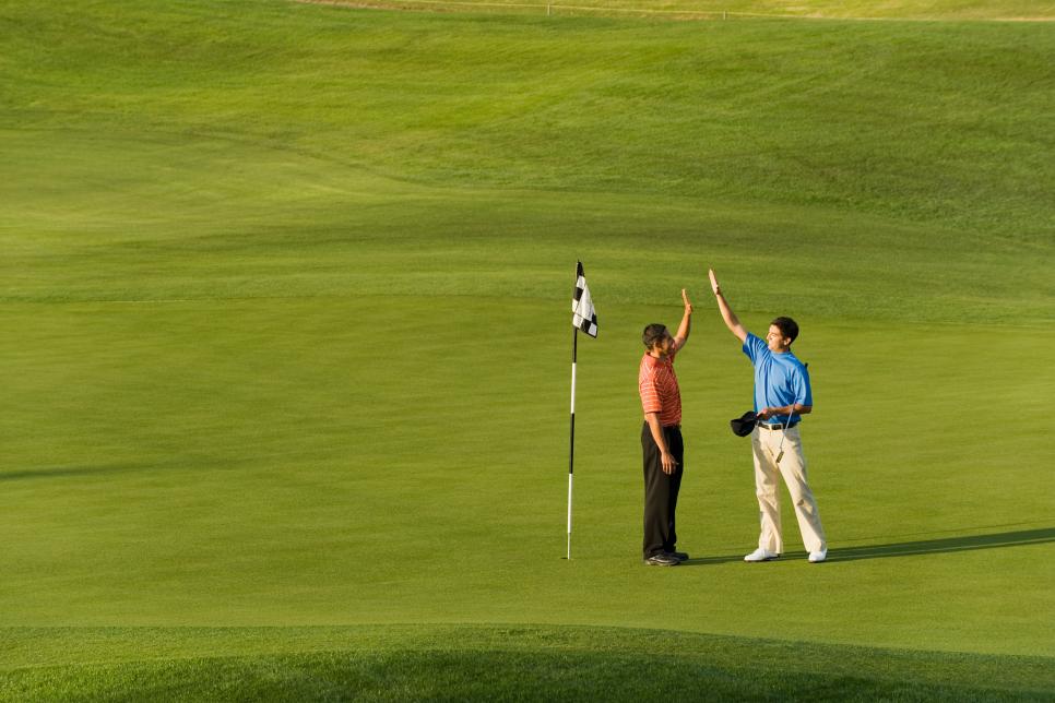 golfers-celebrating-high-five-generic.jpg