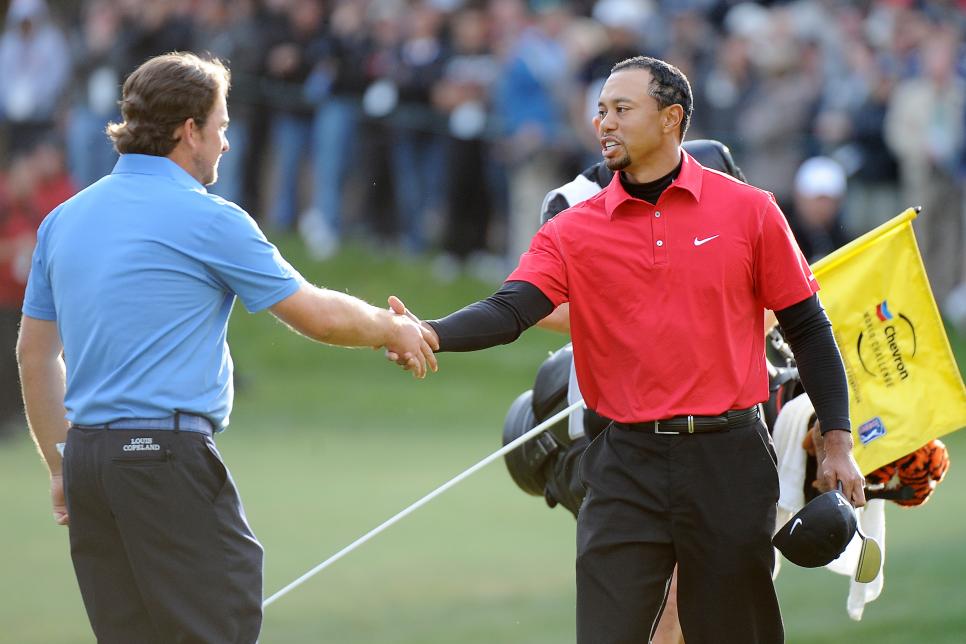 Tiger Woods of USA (R) and Graeme McDowe