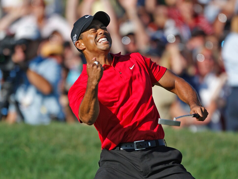 Tiger Woods reacts as he sinks a birdie putt on the 18th hole to force a playoff with Rocco Mediate