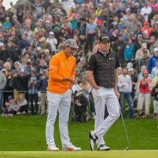 SCOTTSDALE, AZ - FEBRUARY 03: Rickie Fowler and Justin Thomas share a laugh on the 18th green during the final round of the Waste Management Phoenix Open at TPC Scottsdale on February 3, 2019 in Scottsdale, Arizona. (Photo by Tracy Wilcox/PGA TOUR)