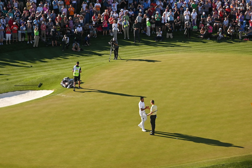 webb-simpson-tony-finau-waste-management-phoenix-open-2020-sunday-wide-shot-handshake.jpg