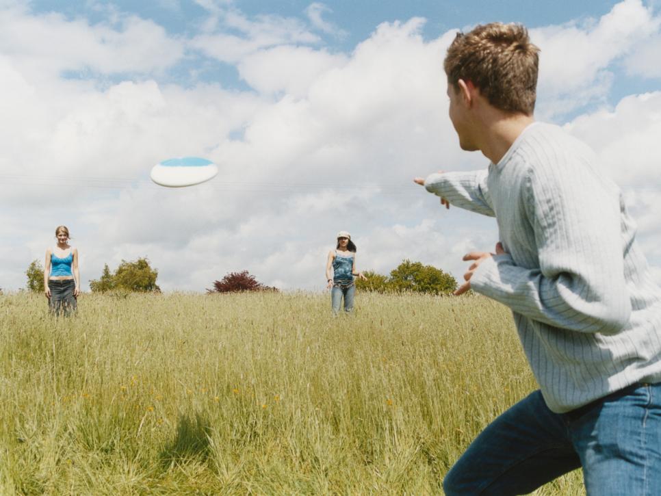 Young People Playing Frisbee