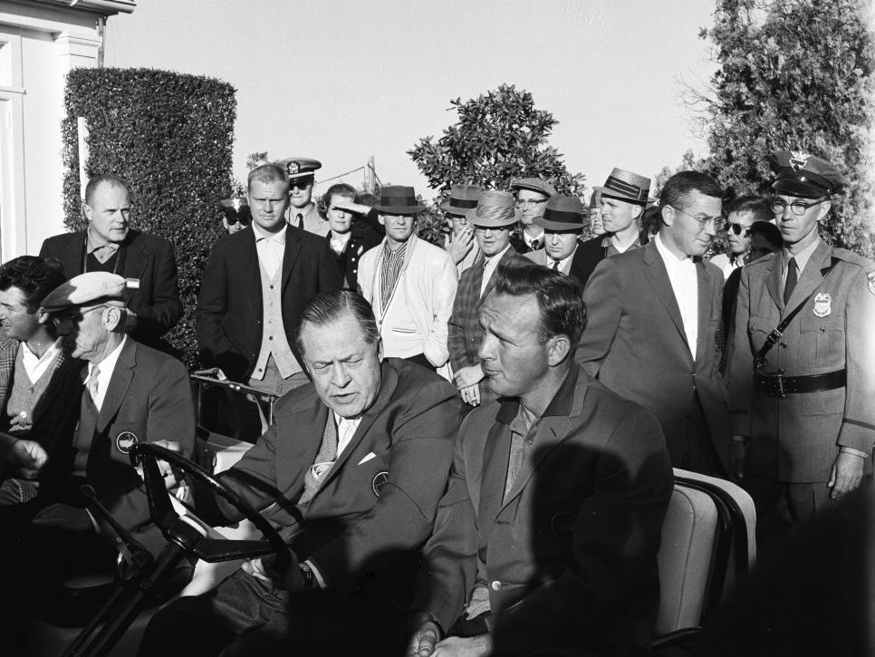 AUGUSTA, GA - APRIL 1960: Winner Arnold Palmer rides alongside Bobby Jones as Jack Nicklaus looks on after the 1960 Masters Tournament at Augusta National Golf Club in April 1960 in Augusta, Georgia. (Photo by Augusta National/Getty Images)