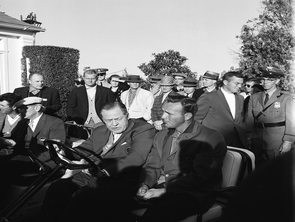 AUGUSTA, GA - APRIL 1960: Winner Arnold Palmer rides alongside Bobby Jones as Jack Nicklaus looks on after the 1960 Masters Tournament at Augusta National Golf Club in April 1960 in Augusta, Georgia. (Photo by Augusta National/Getty Images)