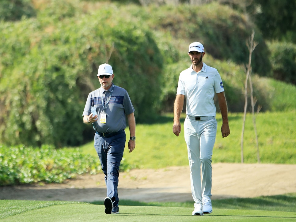 david-winkle-dustin-johnson-walking-fairway-2019.jpg