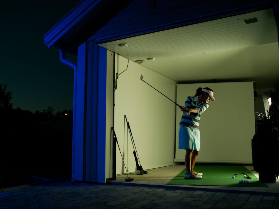 Female golfer in a garage, Sweden.