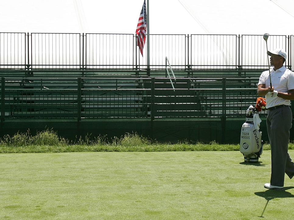 OAKMONT, PA - JUNE 10:  Tiger Woods hits a shot in front of the empty stands on the first tee prior to the start of 107th U.S. Open Championship at Oakmont Country Club on June 10, 2007 in Oakmont, Pennsylvania.  (Photo by Scott Halleran/Getty Images) *** Local Caption *** Tiger Woods