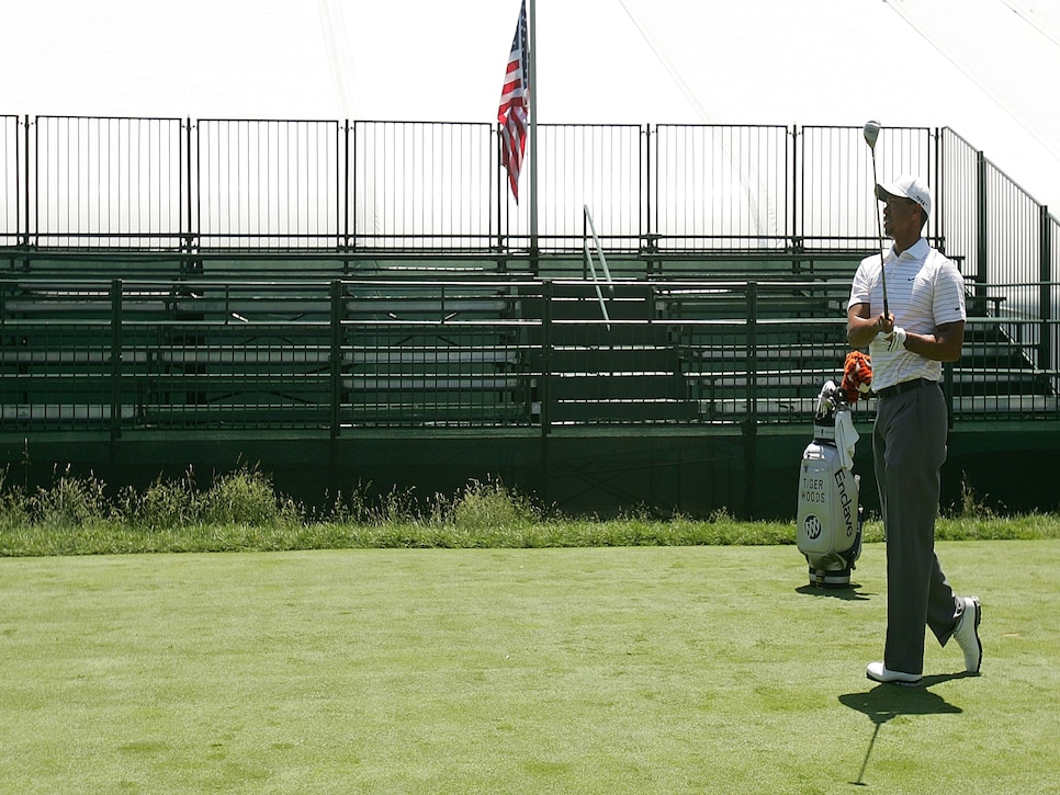 OAKMONT, PA - JUNE 10:  Tiger Woods hits a shot in front of the empty stands on the first tee prior to the start of 107th U.S. Open Championship at Oakmont Country Club on June 10, 2007 in Oakmont, Pennsylvania.  (Photo by Scott Halleran/Getty Images) *** Local Caption *** Tiger Woods