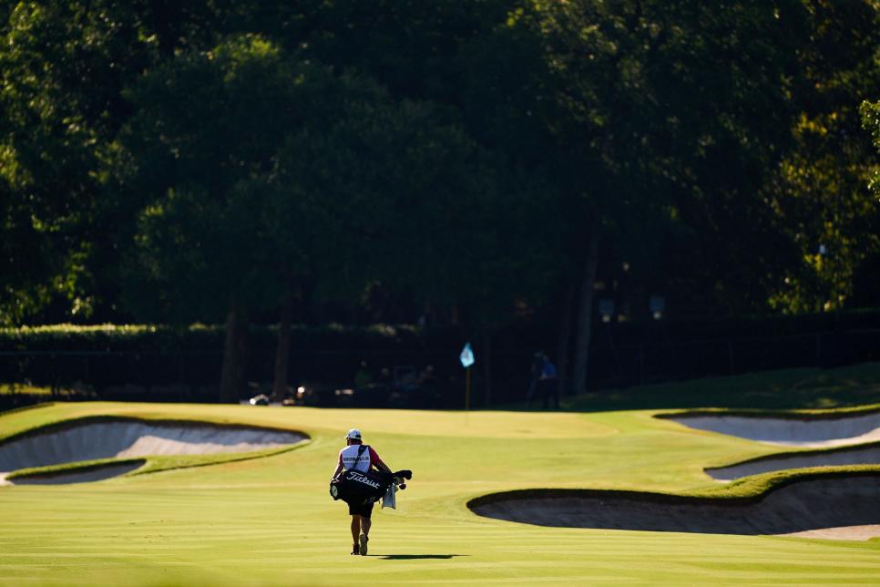/content/dam/images/golfdigest/fullset/2020/06/colonial-photo-essay/DC-colonial-2020-photo-essay-sunday-caddie-walking-to-green.jpg