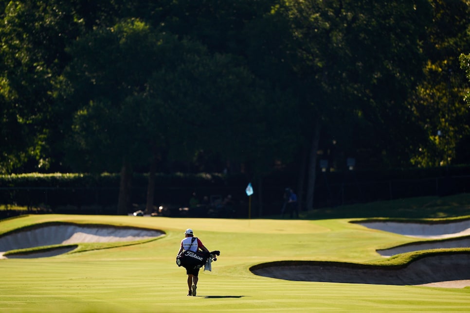 /content/dam/images/golfdigest/fullset/2020/06/colonial-photo-essay/DC-colonial-2020-photo-essay-sunday-caddie-walking-to-green.jpg