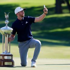 FORT WORTH, TEXAS - JUNE 14: Daniel Berger of the United States takes a selfie as he celebrates with the Leonard Trophy after defeating Collin Morikawa of the United States in a playoff during the final round of the Charles Schwab Challenge on June 14, 2020 at Colonial Country Club in Fort Worth, Texas. (Photo by Ronald Martinez/Getty Images)