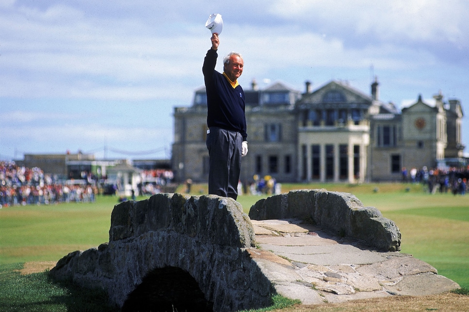 ST. ANDREWS, SCOTLAND - JULY 21:  Arnold Palmer of the USA waves to the crowd from the Swilken Bridge on the 18th hole on July 21, 1995 during the second round of the British Open at St Andrews in Scotland. This proved to be a farewell from Palmer as shortly after the round he announced this would be his last British Open appearance. (Photo by Stephen Munday / Getty Images)