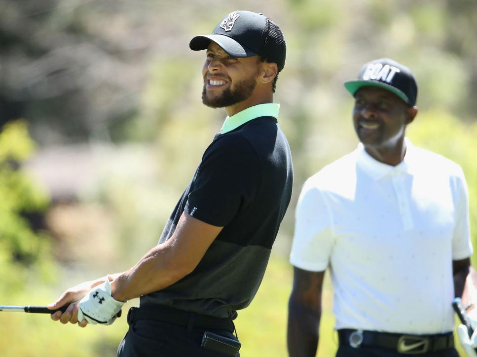SOUTH LAKE TAHOE, NEVADA - JULY 11: NBA athlete Stephen Curry (L) of the Golden State Warriors watches his tee shot alongside former NFL athlete Jerry Rice primarily with the San Francisco 49ers during round two of the American Century Championship at Edgewood Tahoe South golf course on July 11, 2020 in South Lake Tahoe, Nevada. (Photo by Christian Petersen/Getty Images)