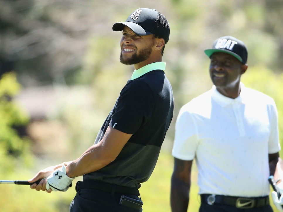 SOUTH LAKE TAHOE, NEVADA - JULY 11: NBA athlete Stephen Curry (L) of the Golden State Warriors watches his tee shot alongside former NFL athlete Jerry Rice primarily with the San Francisco 49ers during round two of the American Century Championship at Edgewood Tahoe South golf course on July 11, 2020 in South Lake Tahoe, Nevada. (Photo by Christian Petersen/Getty Images)