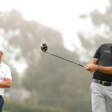 SAN DIEGO, CALIFORNIA - JUNE 14: Phil Mickelson of the United States plays his shot from the 15th tee as Bryson DeChambeau of the United States looks on prior to the start of the 2021 U.S. Open at Torrey Pines Golf Course on June 14, 2021 in San Diego, California. (Photo by Ezra Shaw/Getty Images)