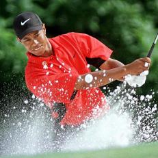 AUGUSTA, :  Tiger Woods of the US chips out of the bunker on the fifth green 13 April during the final round of the Masters tournament at Augusta National Golf Club in Georgia. Woods bogied the hole.    AFP PHOTO/Timothy A. CLARY (Photo credit should read TIMOTHY A. CLARY/AFP via Getty Images)