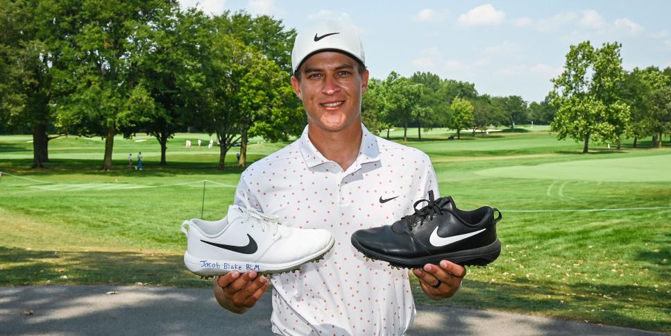 OLYMPIA FIELDS, IL - AUGUST 26:  Cameron Champ poses with his black and white Nike shoes featuring the text Jacob Blake BLM (Black Lives Matter) during a practice round for the BMW Championship on the North Course at Olympia Fields Country Club on August 26, 2020 in Olympia Fields, Illinois. (Photo by Keyur Khamar/PGA TOUR via Getty Images)