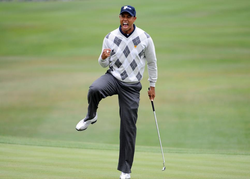 SAN FRANCISCO - OCTOBER 10:  Tiger Woods of the USA Team celebrates his putt for a birdie to win the 17th hole during the Day Three Morning Foursome Matches of The Presidents Cup at Harding Park Golf Course on October 10, 2009 in San Francisco, California.  (Photo by Harry How/Getty Images)
