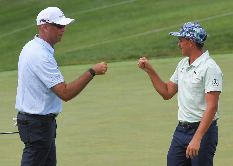 DUBLIN, OH - JULY 11: Stewart Cink and Rickie Fowler bump fist from a distance on the 18th green during the third round of the Workday Charity Open at Muirfield Golf Club on July 11, 2020 in Dublin, Ohio. (Photo by Stan Badz/PGA TOUR via Getty Images)