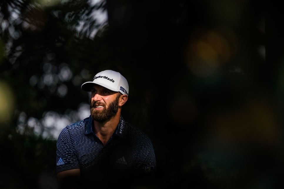 /content/dam/images/golfdigest/fullset/2020/11/masters-2020-essay-sunday-dustin-johnson-through-trees-cuban.jpg