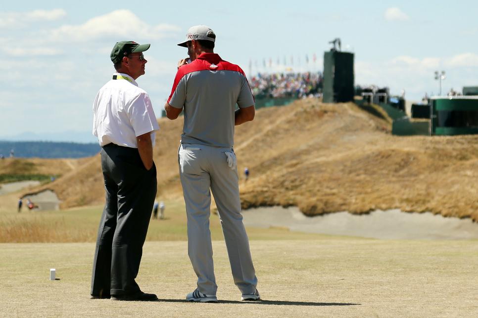 UNIVERSITY PLACE, WA - JUNE 20:  Dustin Johnson of the United States chats on the first tee with USGA executive director Mike Davis during the third round of the 115th U.S. Open Championship at Chambers Bay on June 20, 2015 in University Place, Washington.  (Photo by Mike Ehrmann/Getty Images)