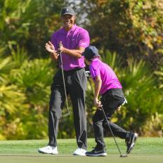 ORLANDO, FL - DECEMBER 19: Tiger Woods claps as his son Charlie Woods makes an eagle putt on the third green during the first round of the PGA TOUR Champions PNC Championship at Ritz-Carlton Golf Club on December 19, 2020 in Orlando, Florida. (Photo by Ben Jared/PGA TOUR via Getty Images)
