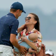 HILTON HEAD ISLAND, SOUTH CAROLINA - APRIL 17: Jordan Spieth and wife Annie Verret celebrate with son Sammy on the 18th green after Spieth beat Patrick Cantlay in a playoff to win the RBC Heritage at Harbor Town Golf Links on April 17, 2022 in Hilton Head Island, South Carolina. (Photo by Kevin C. Cox/Getty Images)