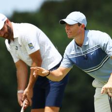 JUNO BEACH, FLORIDA - MAY 17: Dustin Johnson of the American Nurses Foundation team and Rory McIlroy of the American Nurses Foundation team look on during the TaylorMade Driving Relief Supported By UnitedHealth Group on May 17, 2020 at Seminole Golf Club in Juno Beach, Florida. (Photo by Mike Ehrmann/Getty Images)