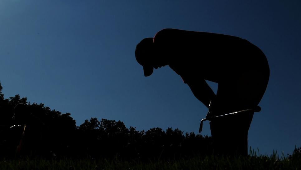 CHASKA, MN - AUGUST 16:  Tiger Woods (R) reacts to his tee shot on the 17th hole as caddie Steve Williams walks off during the final round of the 91st PGA Championship at Hazeltine National Golf Club on August 16, 2009 in Chaska, Minnesota.  (Photo by Stuart Franklin/Getty Images)