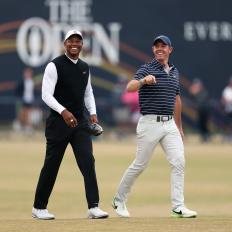 ST ANDREWS, SCOTLAND - JULY 11: Tiger Woods of The USA and Rory McIlroy of Northern Ireland on the 18th fairway  during the Celebration of Champions prior to The 150th Open at St Andrews Old Course on July 11, 2022 in St Andrews, Scotland. (Photo by Oisin Keniry/R&A/R&A via Getty Images)