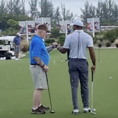 Tiger Woods gave some lucky guy a putting lesson and now he can't miss