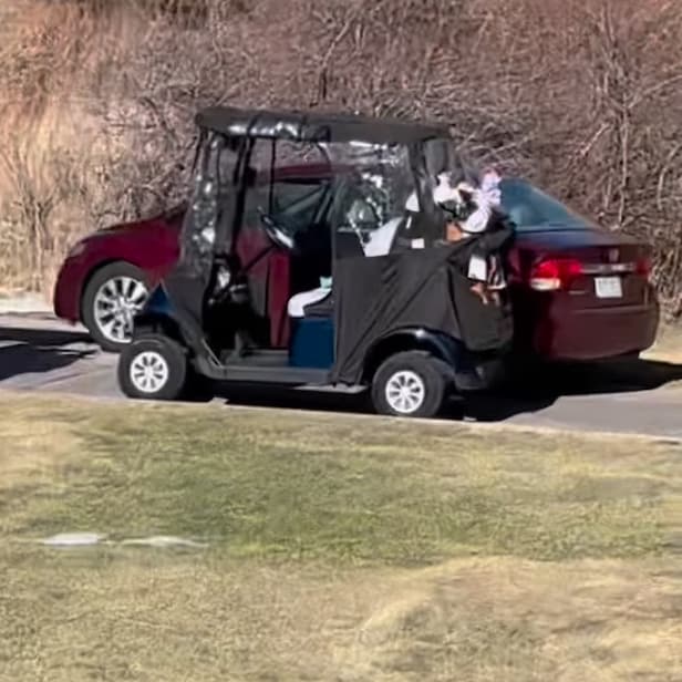 woman-attempts-to-drive-car-down-golf-course-cartpath,-fails-miserably
