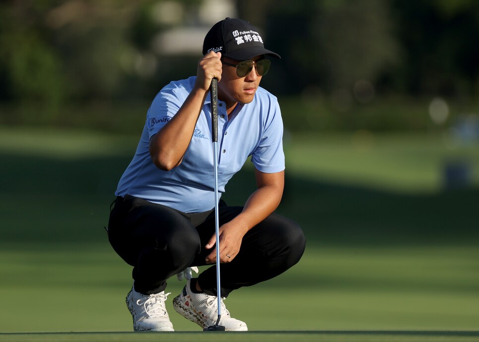 HONOLULU, HAWAII - JANUARY 15: C.T. Pan of Taiwan lines up a putt on the 13th green during the second round of the Sony Open in Hawaii at the Waialae Country Club on January 15, 2021 in Honolulu, Hawaii. (Photo by Gregory Shamus/Getty Images)