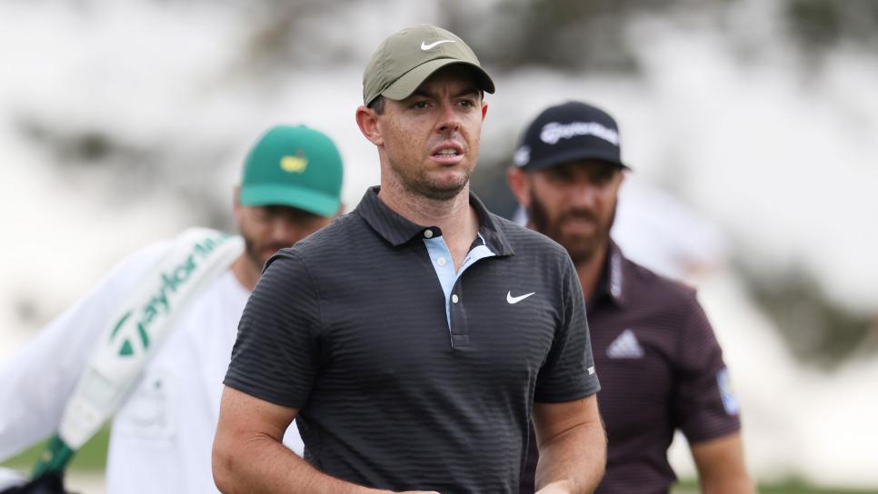 AUGUSTA, GEORGIA - NOVEMBER 11: Rory McIlroy of Northern Ireland and Dustin Johnson of the United States look on after playing their shots on the third tee during a practice round prior to the Masters at Augusta National Golf Club on November 11, 2020 in Augusta, Georgia. (Photo by Rob Carr/Getty Images)