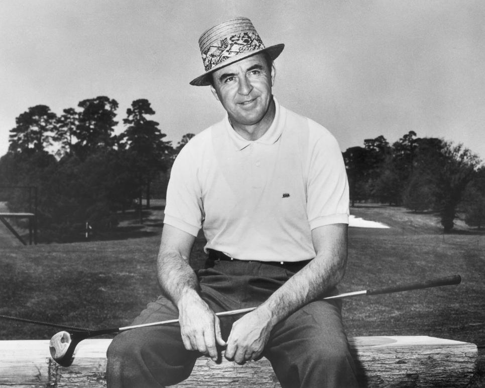 circa 1960:  American golfer Sam Snead (1912 - 2002) sitting on a bench along side a golf course with a golf club across his lap.  (Photo by Joan Roth/Hulton Archive/Getty Images)