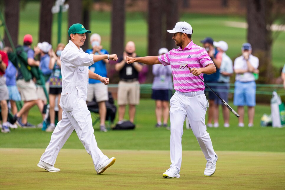 /content/dam/images/golfdigest/fullset/2021/4/xander-schauffele-masters-2021-saturday-walton-caddie-fist-bump.jpg