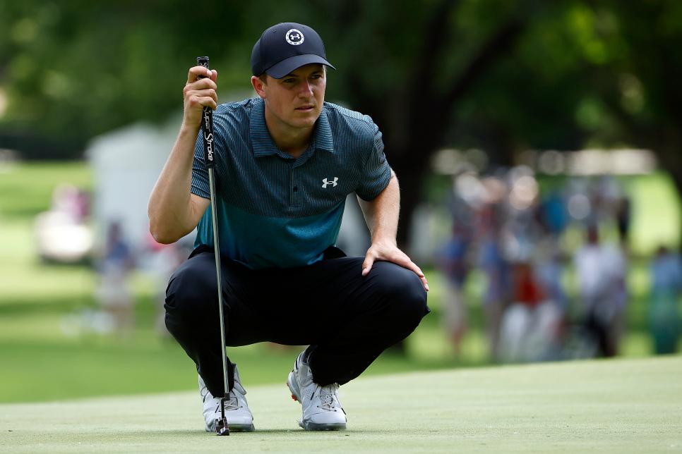 Jordan Spieth lines up his putt on the second hole green during the third r...