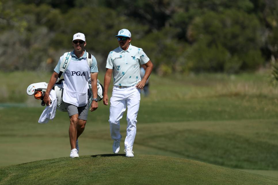 KIAWAH ISLAND, SOUTH CAROLINA - MAY 20: Rickie Fowler of the United States and caddie Joe Skovron walk up the second hole during the first round of the 2021 PGA Championship at Kiawah Island Resort's Ocean Course on May 20, 2021 in Kiawah Island, South Carolina. (Photo by Gregory Shamus/Getty Images)
