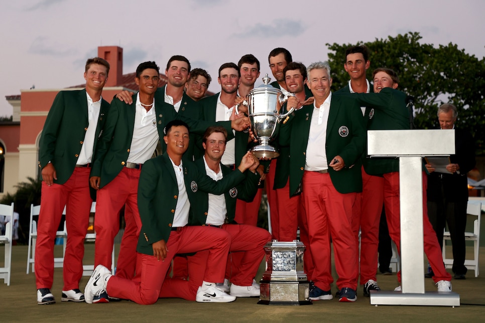 JUNO BEACH, FLORIDA - MAY 09: Team USA poses with the trophy after defeating Team Great Britain and Ireland on Day Two of The Walker Cup at Seminole Golf Club on May 09, 2021 in Juno Beach, Florida. (Photo by Cliff Hawkins/Getty Images)