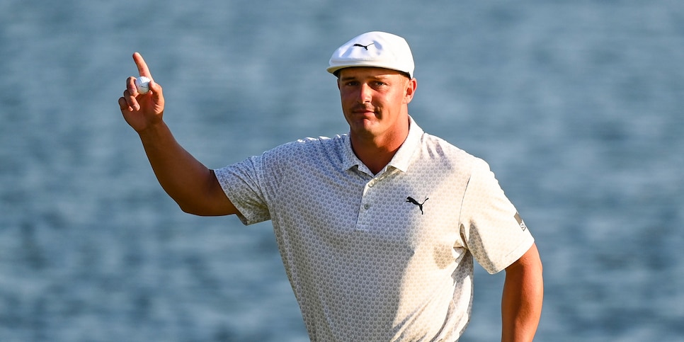 PONTE VEDRA BEACH, FL - MARCH 14:  Bryson DeChambeau smiles and waves his ball to fans on the 18th hole green during the final round of THE PLAYERS Championship on the Stadium Course at TPC Sawgrass on March 14, 2021, in Ponte Vedra Beach, Florida. (Photo by Keyur Khamar/PGA TOUR via Getty Images)