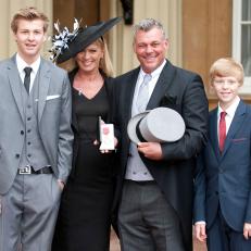 LONDON, UNITED KINGDOM - NOVEMBER 21:Darren Clarke poses with his wife, former Miss Northern Ireland Alison Campbel, and  sons, Tyrone (L) and Conor after being awarded an OBE at Buckingham Palace for services to Golf , at Buckingham Palace on November 21, 2012 in London, England.  (Photo by Mark Large - WPA Pool/Getty Images)