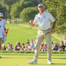 OMAHA, NEBRASKA - JULY 11: Jim Furyk of the United States reacts in front of Michael "Fluff" Cowan after winning the U.S. Senior Open Championship at the Omaha Country Club  on July 11, 2021 in Omaha, Nebraska. (Photo by Quinn Harris/Getty Images)