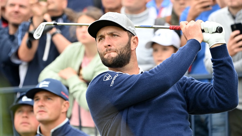 Spain's Jon Rahm watches his iron shot from the 3rd tee during a practice round for The 149th British Open Golf Championship at Royal St George's, Sandwich in south-east England on July 14, 2021. - RESTRICTED TO EDITORIAL USE (Photo by Paul ELLIS / AFP) / RESTRICTED TO EDITORIAL USE (Photo by PAUL ELLIS/AFP via Getty Images)