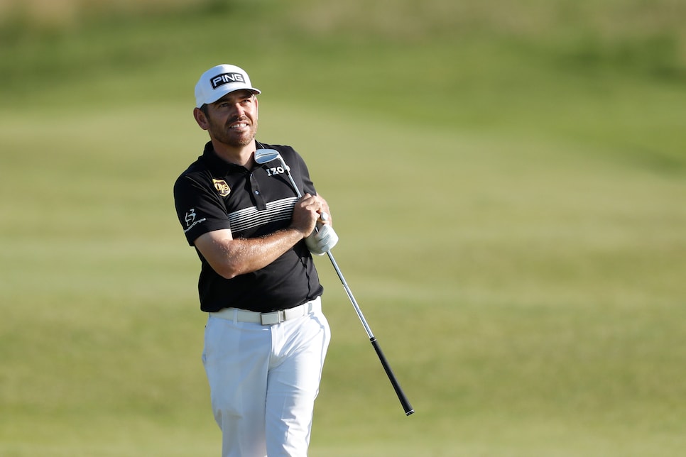 SANDWICH, ENGLAND - JULY 16: Louis Oosthuizen of South Africa watches his shot from the 13th fairway during Day Two of The 149th Open at Royal St George’s Golf Club on July 16, 2021 in Sandwich, England. (Photo by Oisin Keniry/Getty Images)