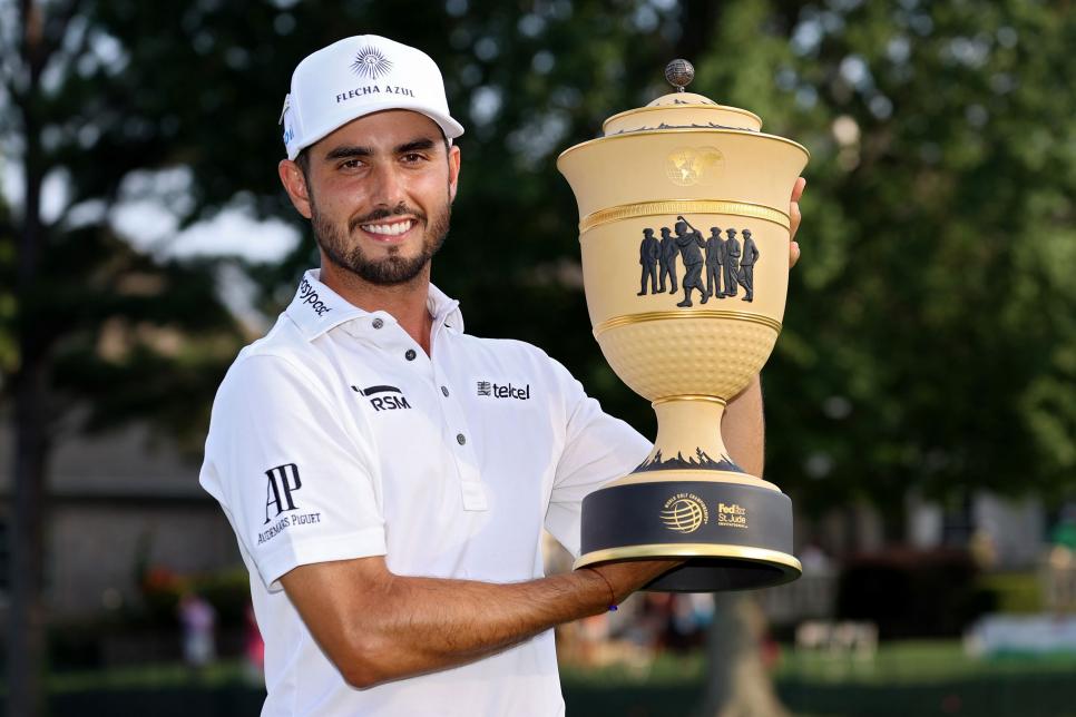 MEMPHIS, TENNESSEE - AUGUST 08: Abraham Ancer of Mexico poses with the trophy after winning the FedEx St. Jude Invitational after the second playoff hole at TPC Southwind on August 08, 2021 in Memphis, Tennessee. (Photo by Sam Greenwood/Getty Images)
