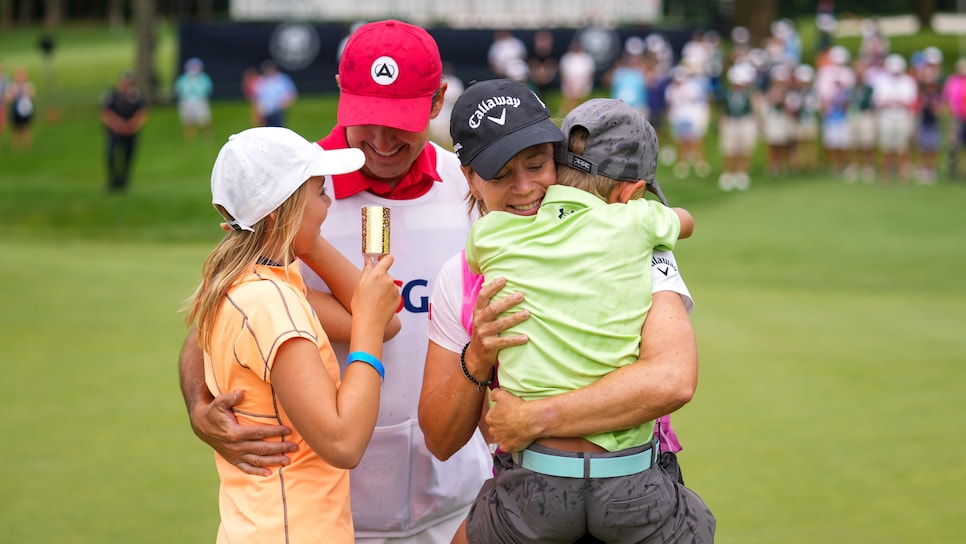 Annika Sorenstam hugs her son Will, as her daughter Ava and her caddie/husband, Mike McGee looks on after she won the 2021 U.S. Senior Women's Open at Brooklawn Country Club in Fairfield, Conn. on Sunday, Aug. 1, 2021. (Darren Carroll/USGA)