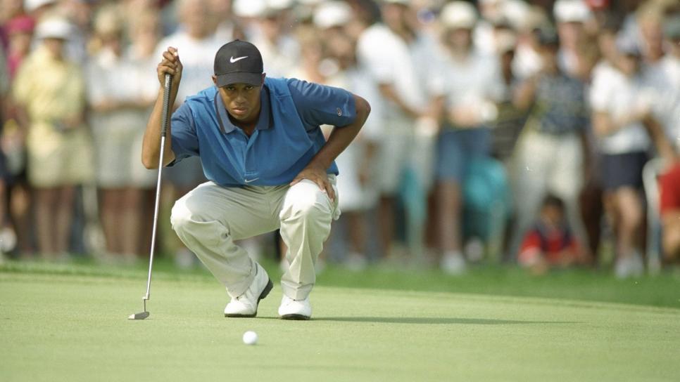 31 Aug 1996:  Tiger Woods lines up a shot during the Greater Milwaukee Open at the Brown Deer Park golf course in Milwaukee, Wisconsin. Mandatory Credit: J.D. Cuban  /Allsport