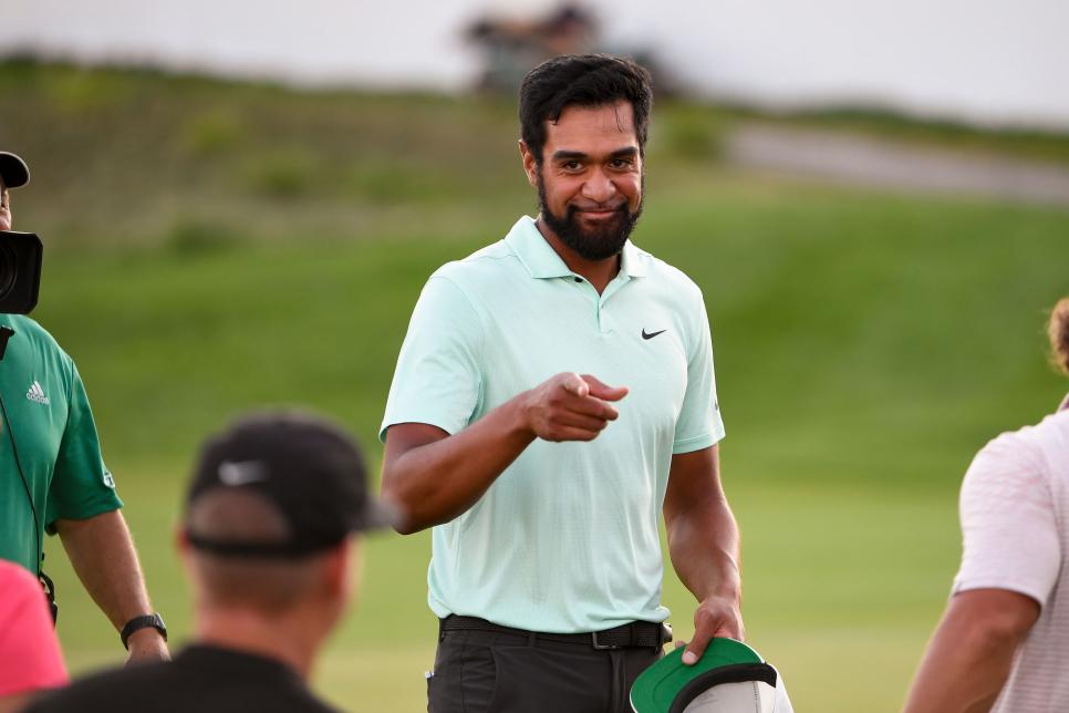 JERSEY CITY, NJ - AUGUST 23: Tony Finau points to his coach, Boyd Summerhays after winning in a playoff during the weather delayed final round of THE NORTHERN TRUST at Liberty National Golf Club on August 23, 2021 in Jersey City, New Jersey. (Photo by Tracy Wilcox/PGA TOUR via Getty Images)